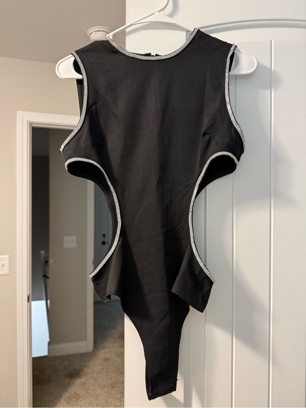 Black bodysuit with little diamonds lining the sides